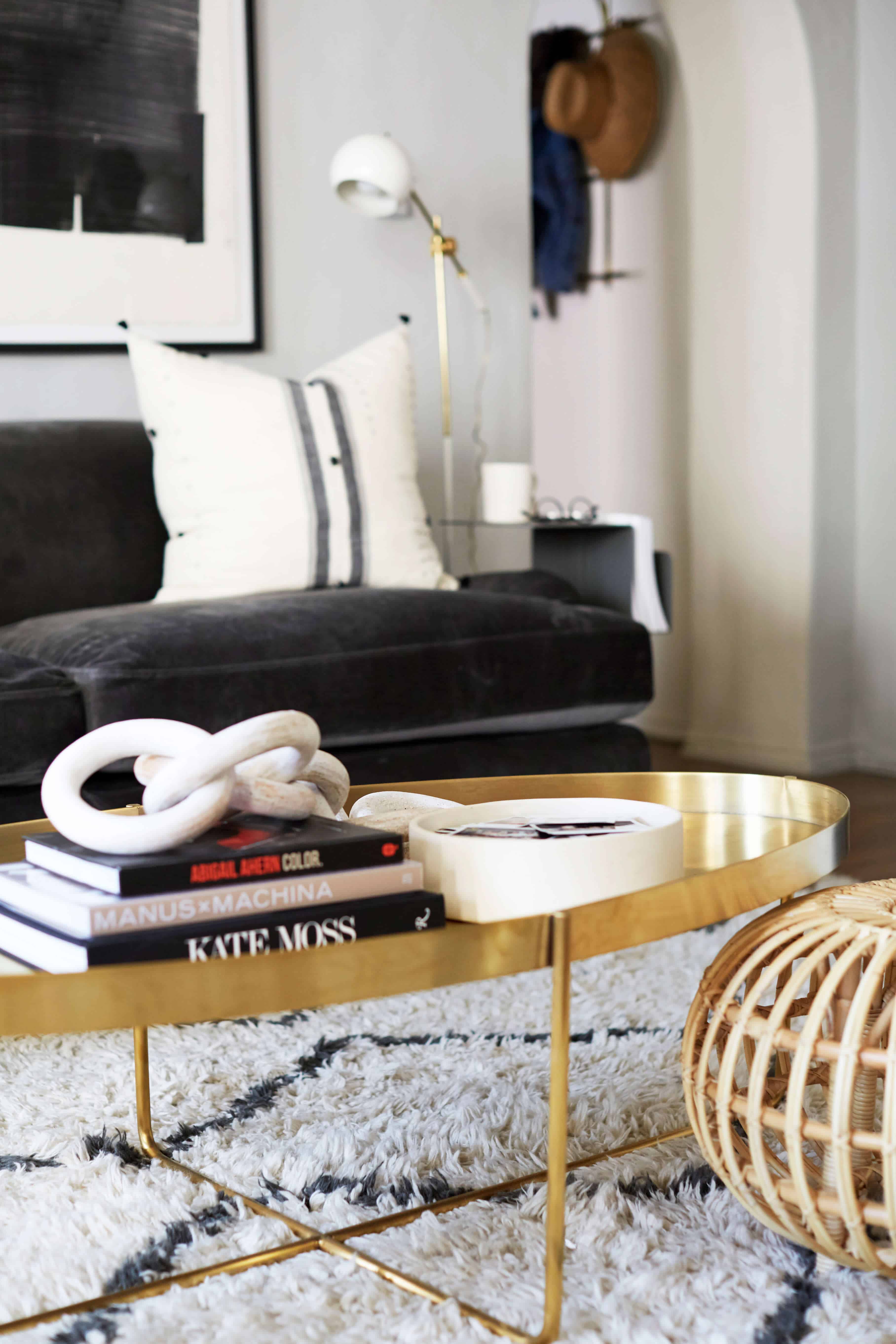 brady-tolbert-design_emily-henderson_living-room_eclectic_pavillion-grey_farrow-and-ball_brass-coffee-table_english-roll-arm_albini_masculine_traditional_west-elm_souk_flokati_leather_12