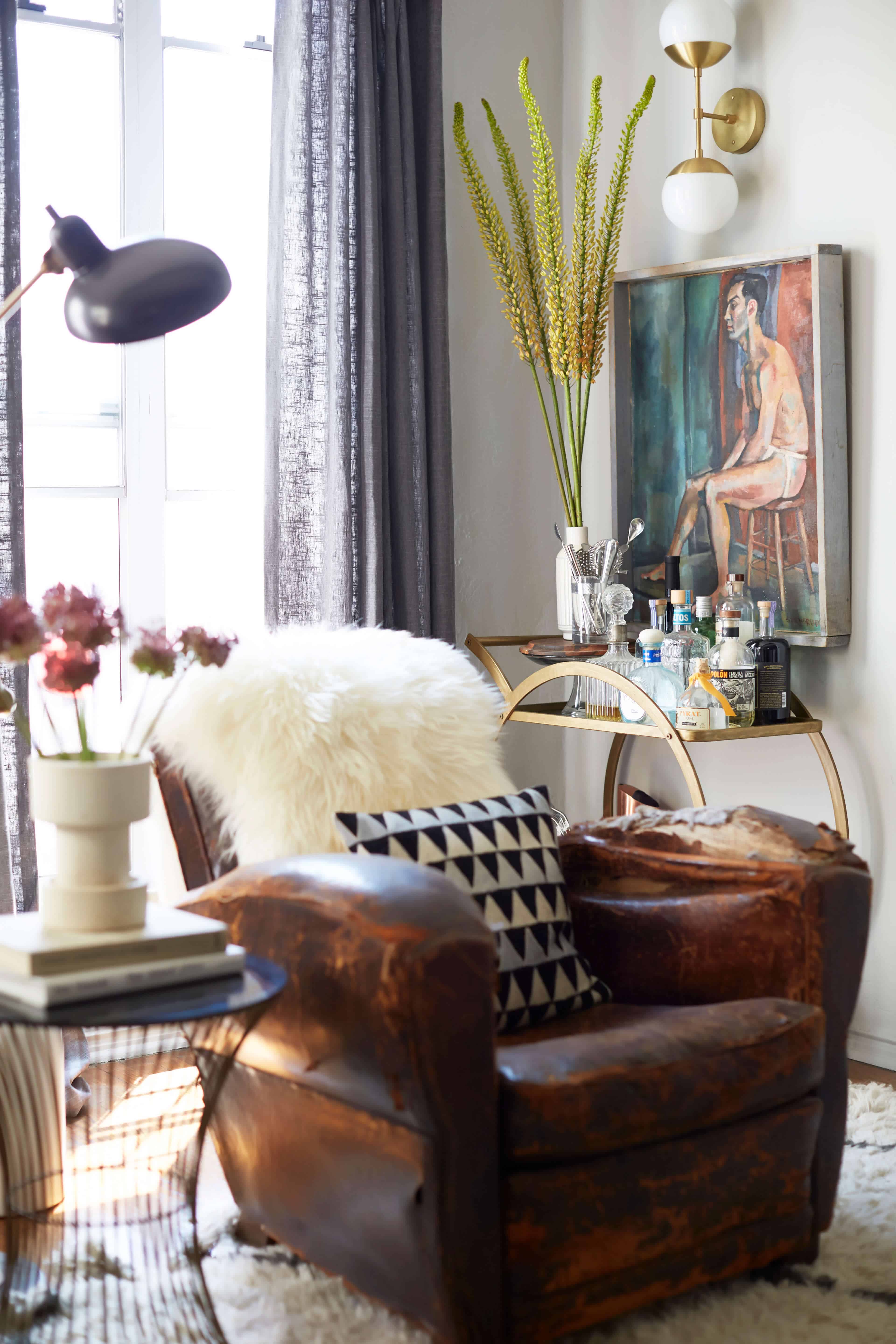 brady-tolbert-design_emily-henderson_living-room_eclectic_pavillion-grey_farrow-and-ball_brass-coffee-table_english-roll-arm_albini_masculine_traditional_west-elm_souk_flokati_leather_13