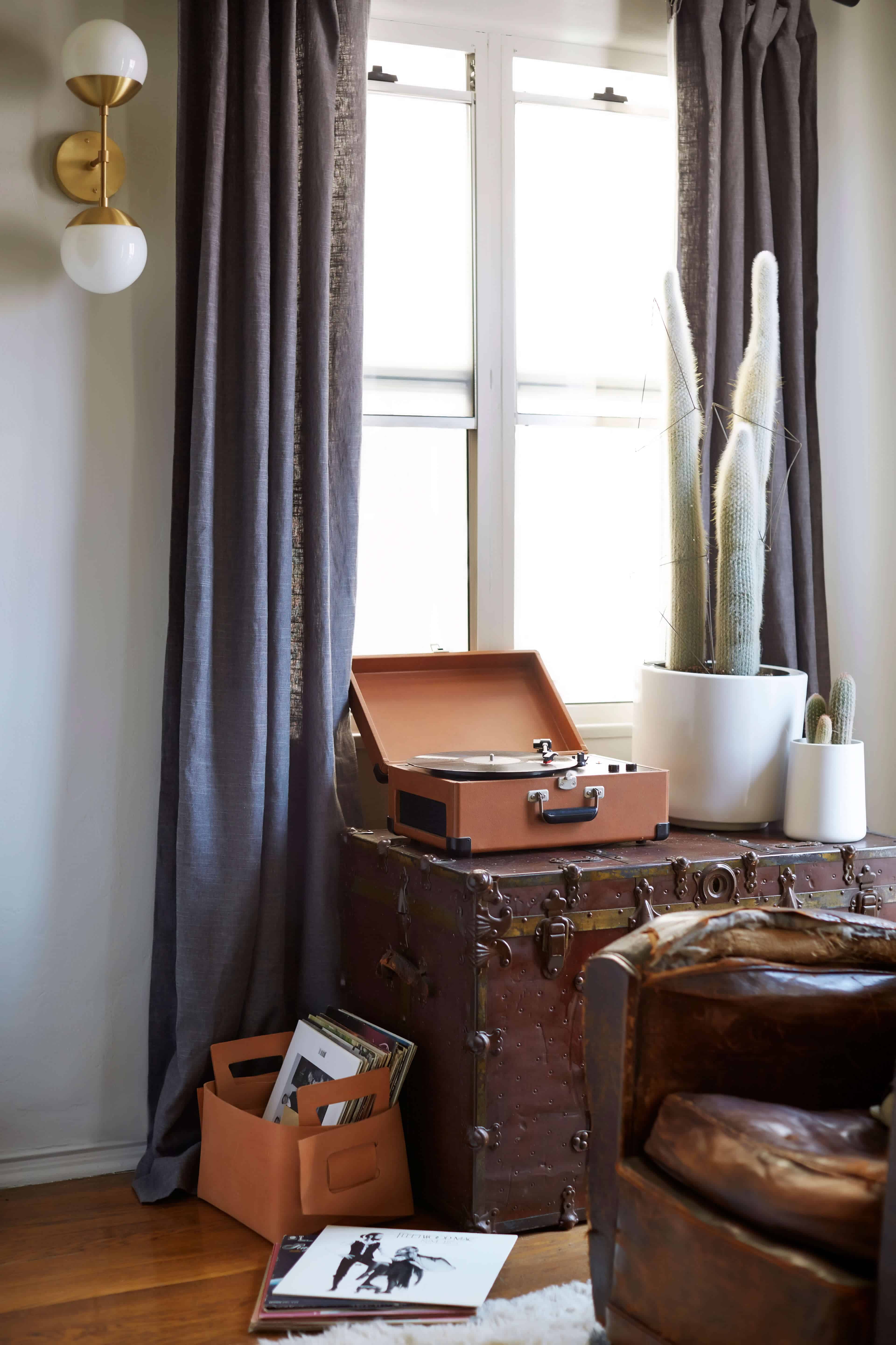 brady-tolbert-design_emily-henderson_living-room_eclectic_pavillion-grey_farrow-and-ball_brass-coffee-table_english-roll-arm_albini_masculine_traditional_west-elm_souk_flokati_leather_18