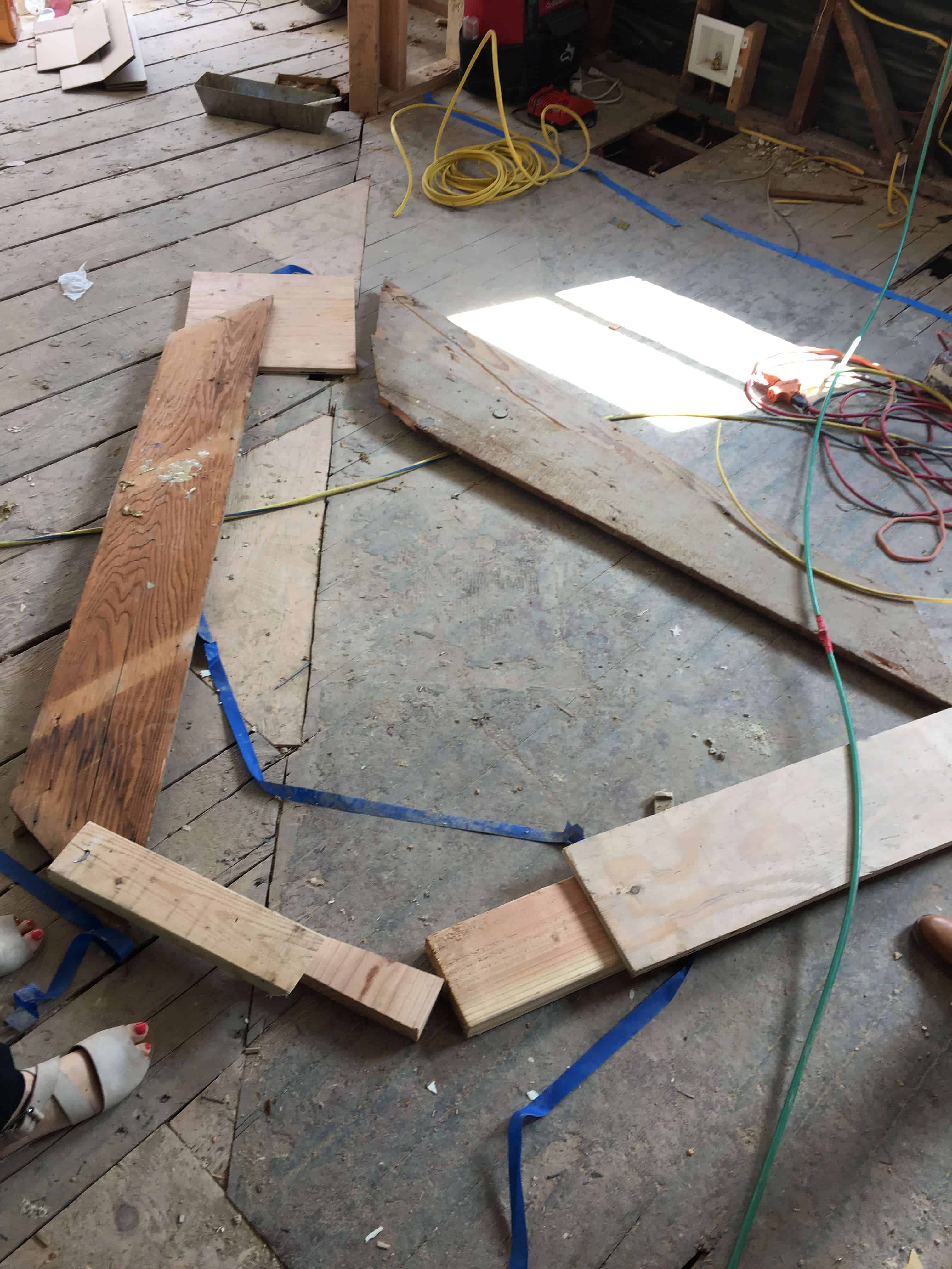 progress_kitchen_demo_floor-demo_island-roughed-out_wood-on-floor