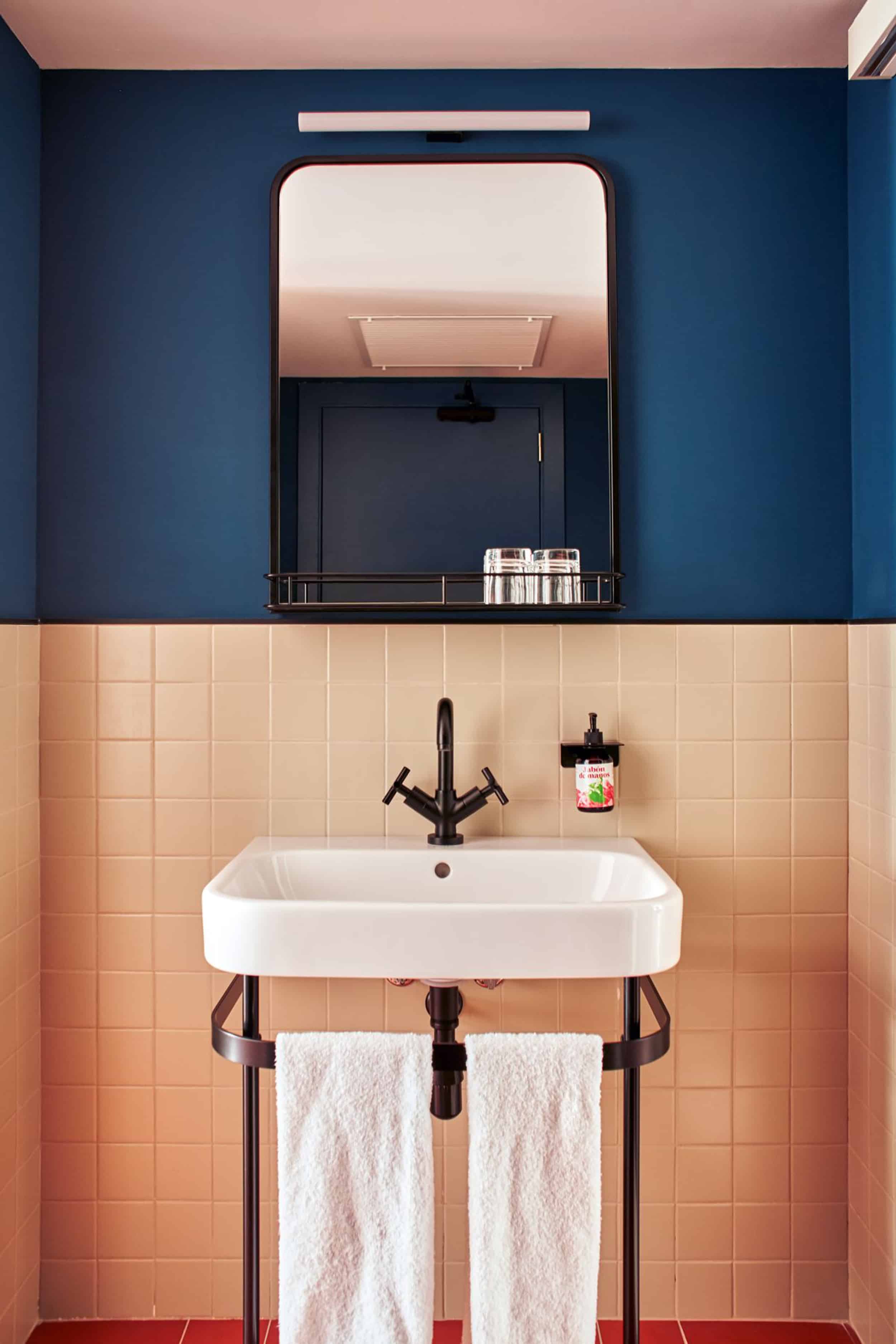 Blue bathroom coral tile black fixtures