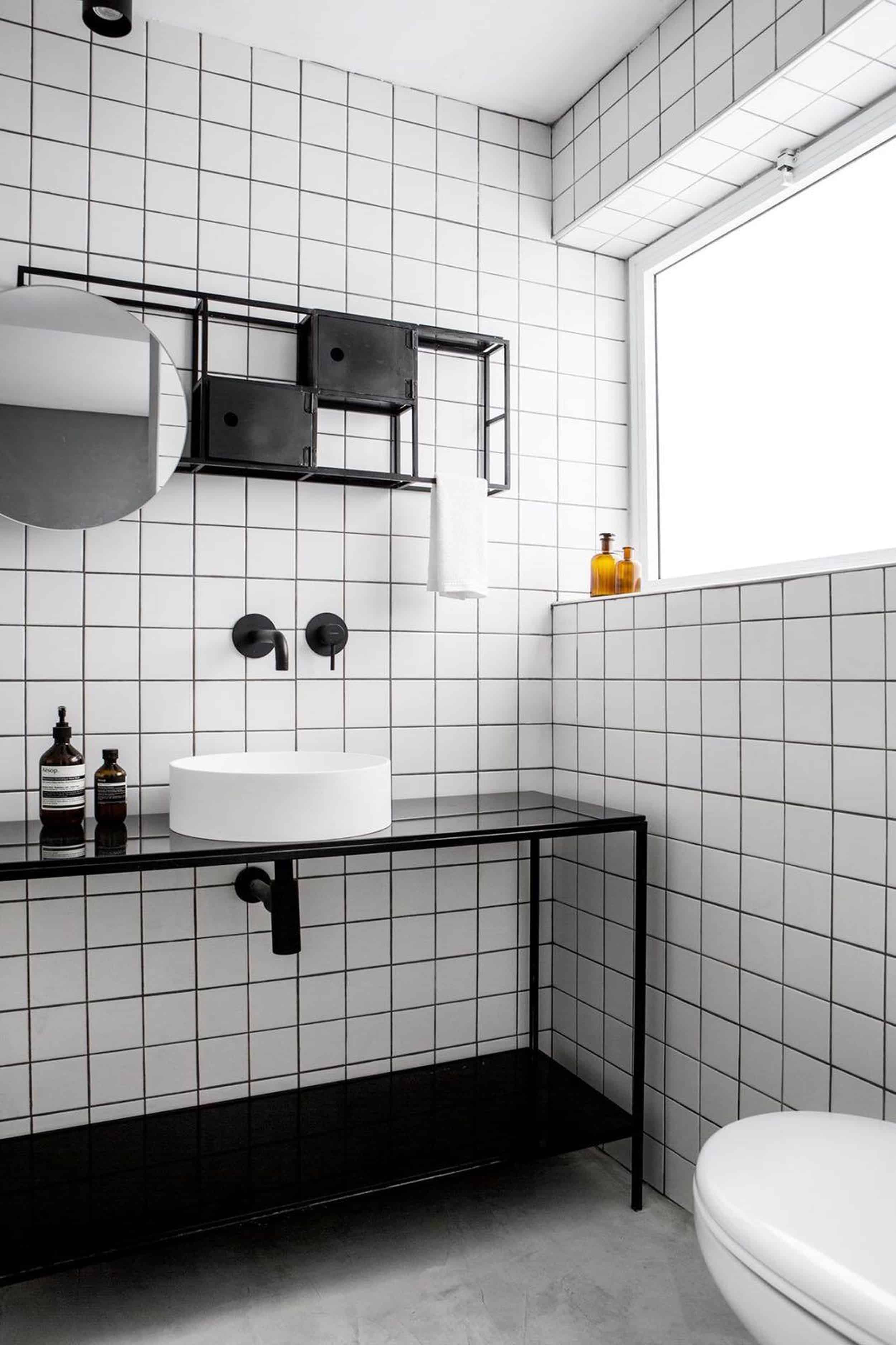 back and white bathroom grid tiles vessel sink wall mount faucet