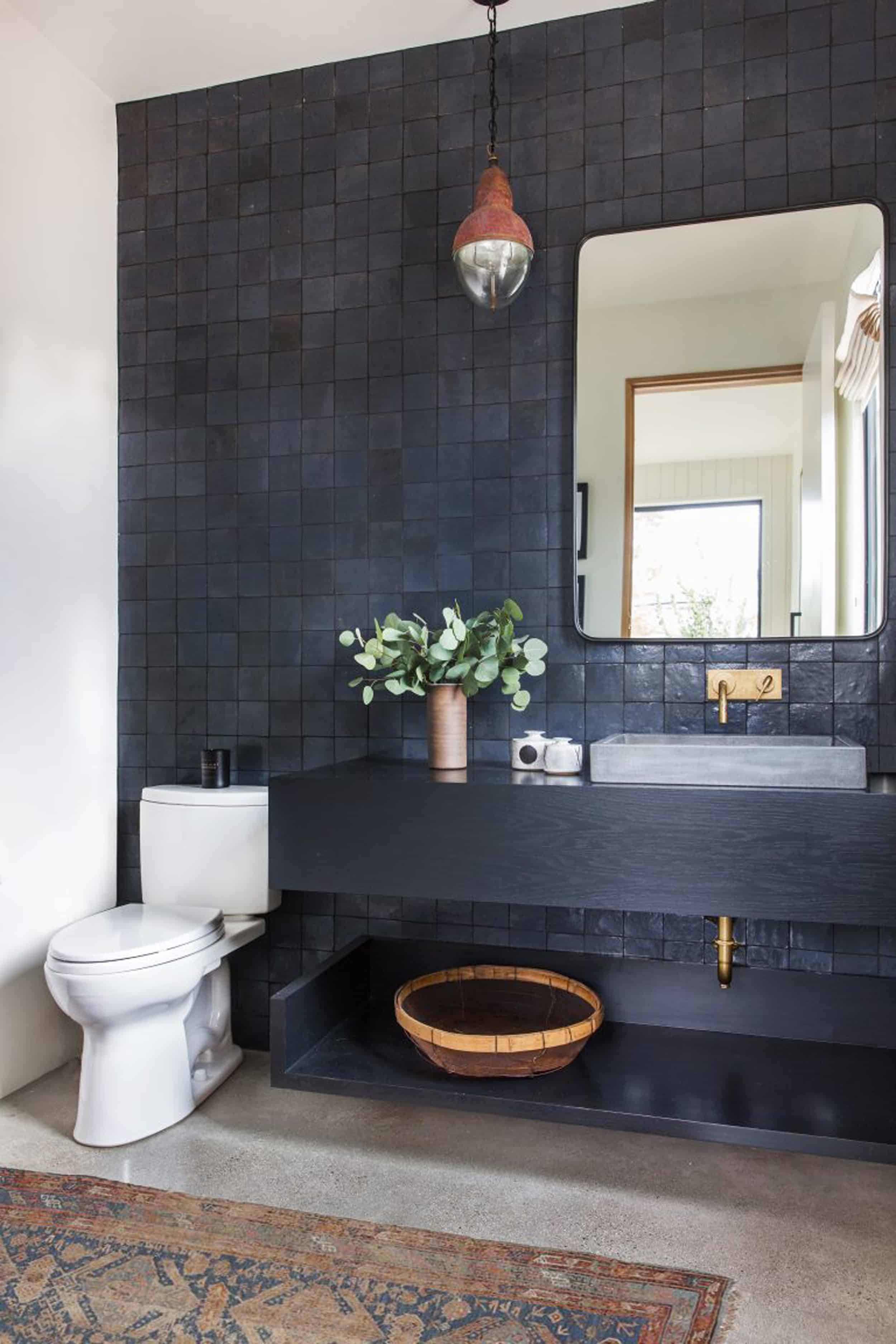 Navy Blue Tile wall black wood vanity brass faucets