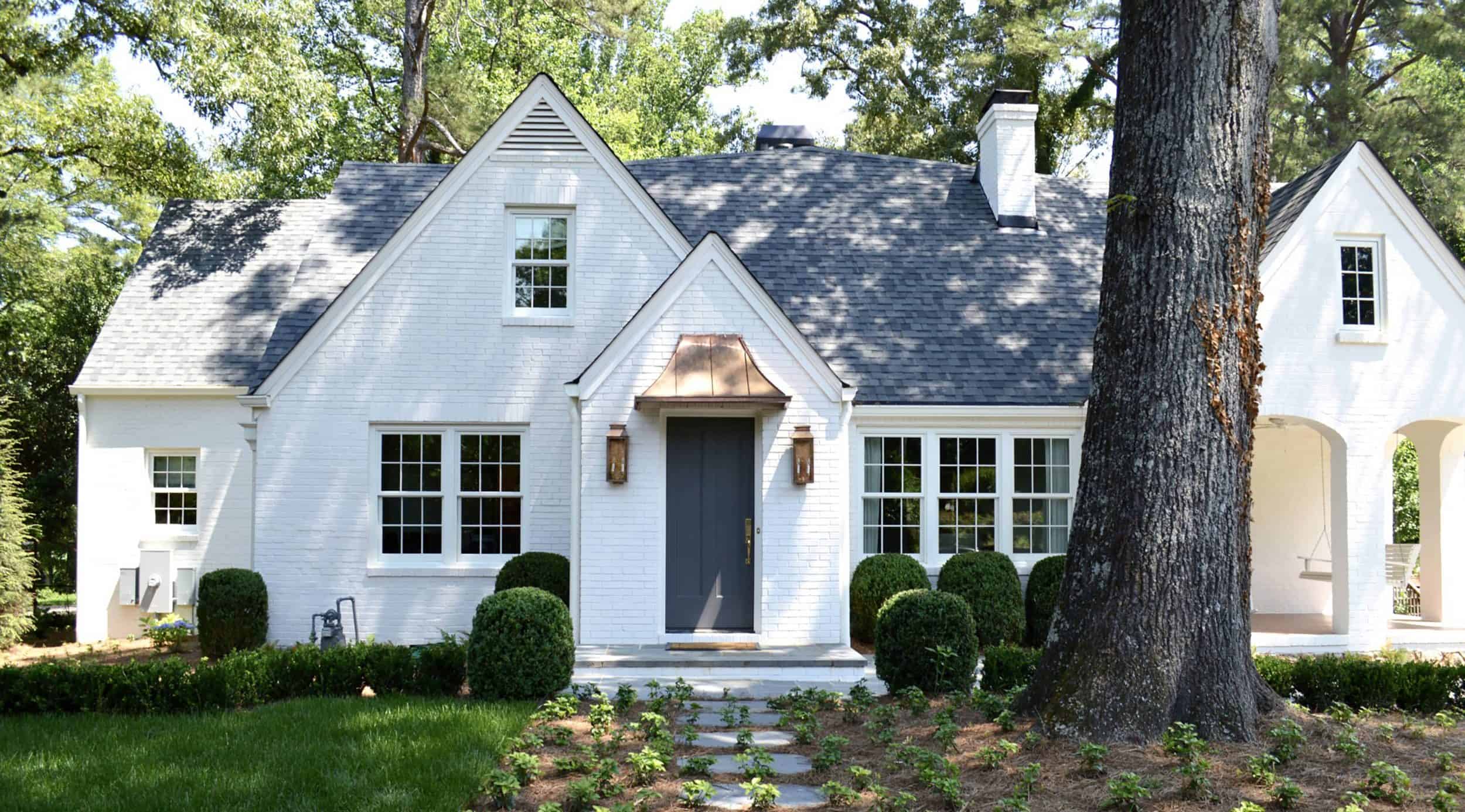 White Brick Tudor With Blue Door