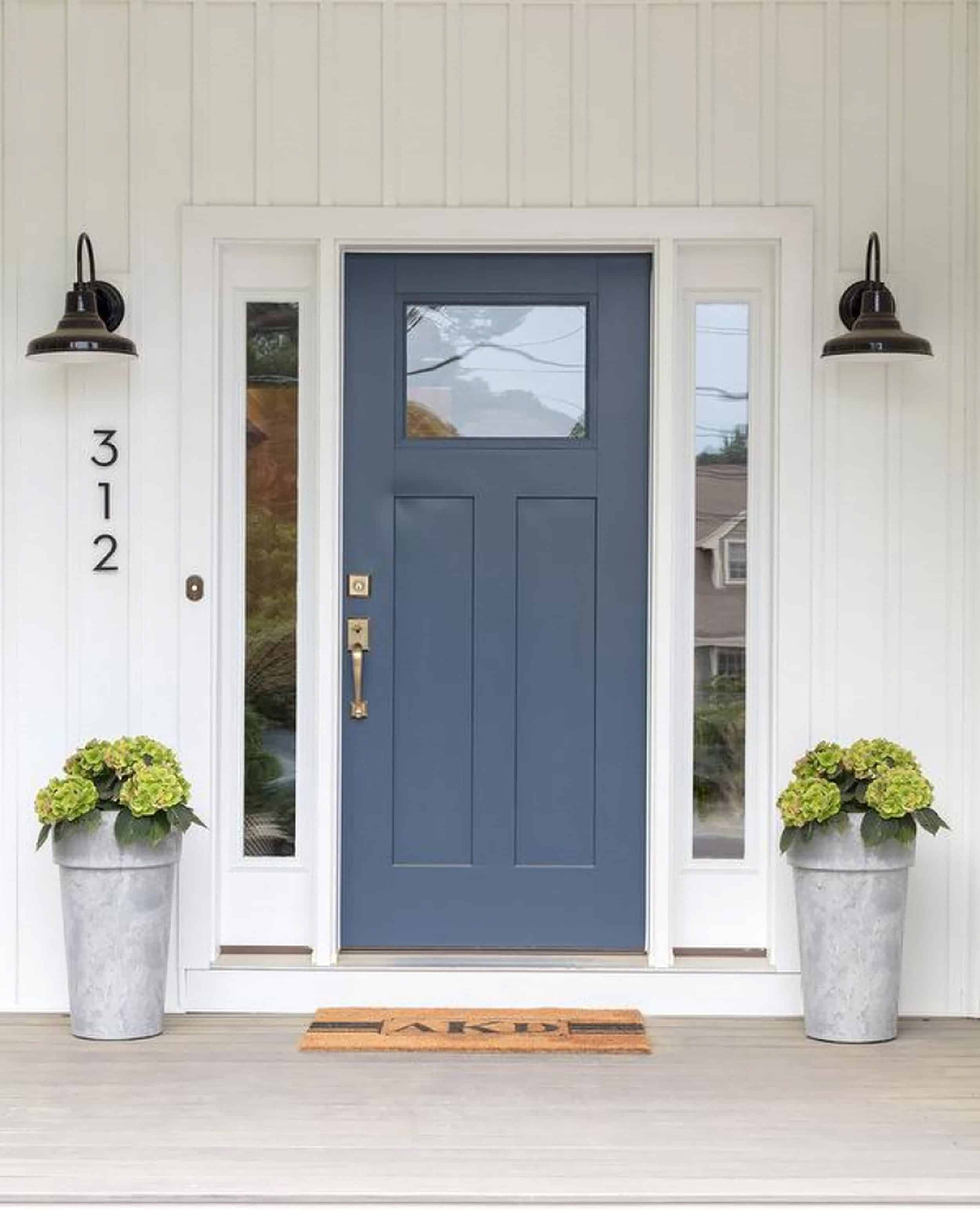 House With White Siding And Slate Blue Door