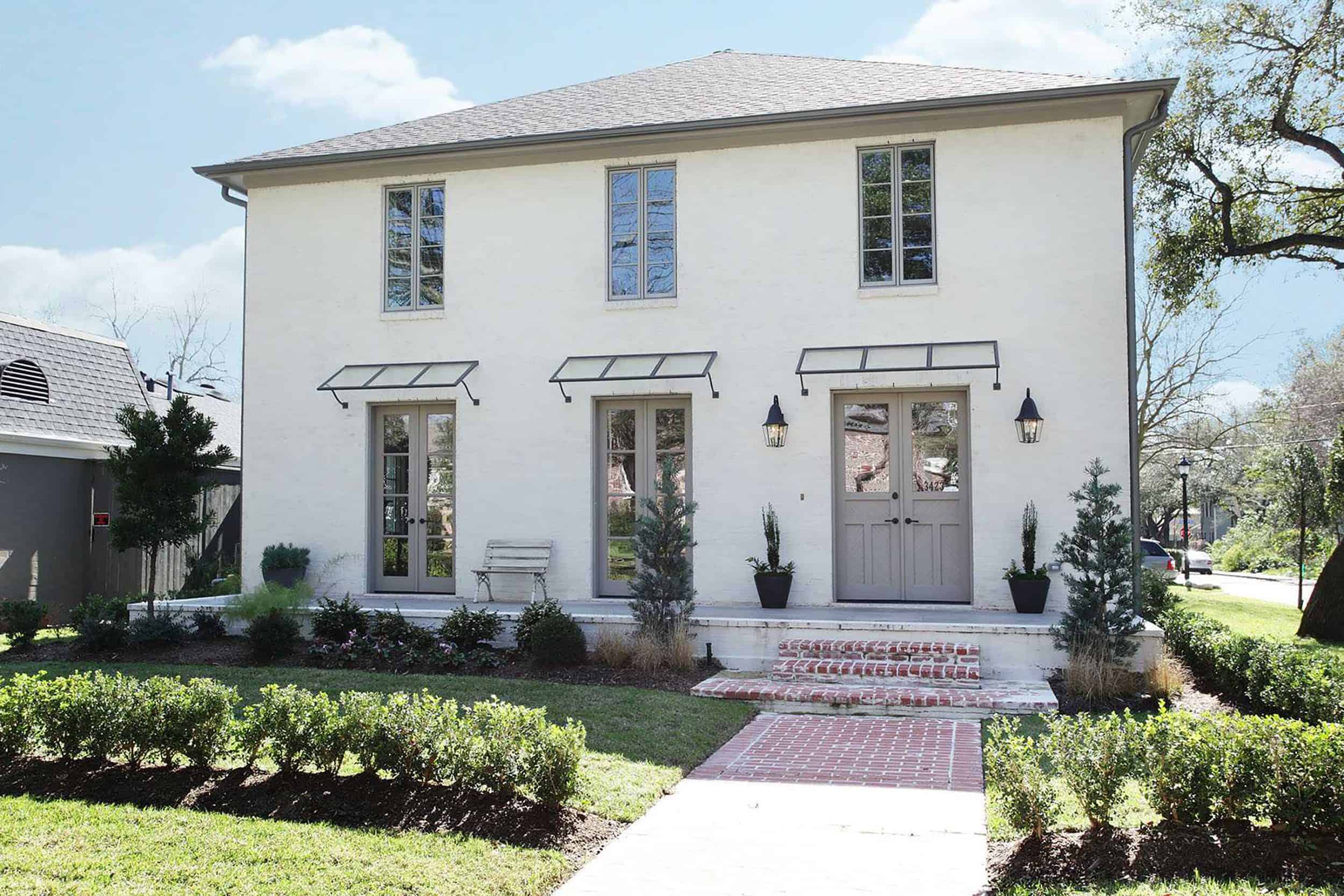 White Home With Light Gray Trim and Door