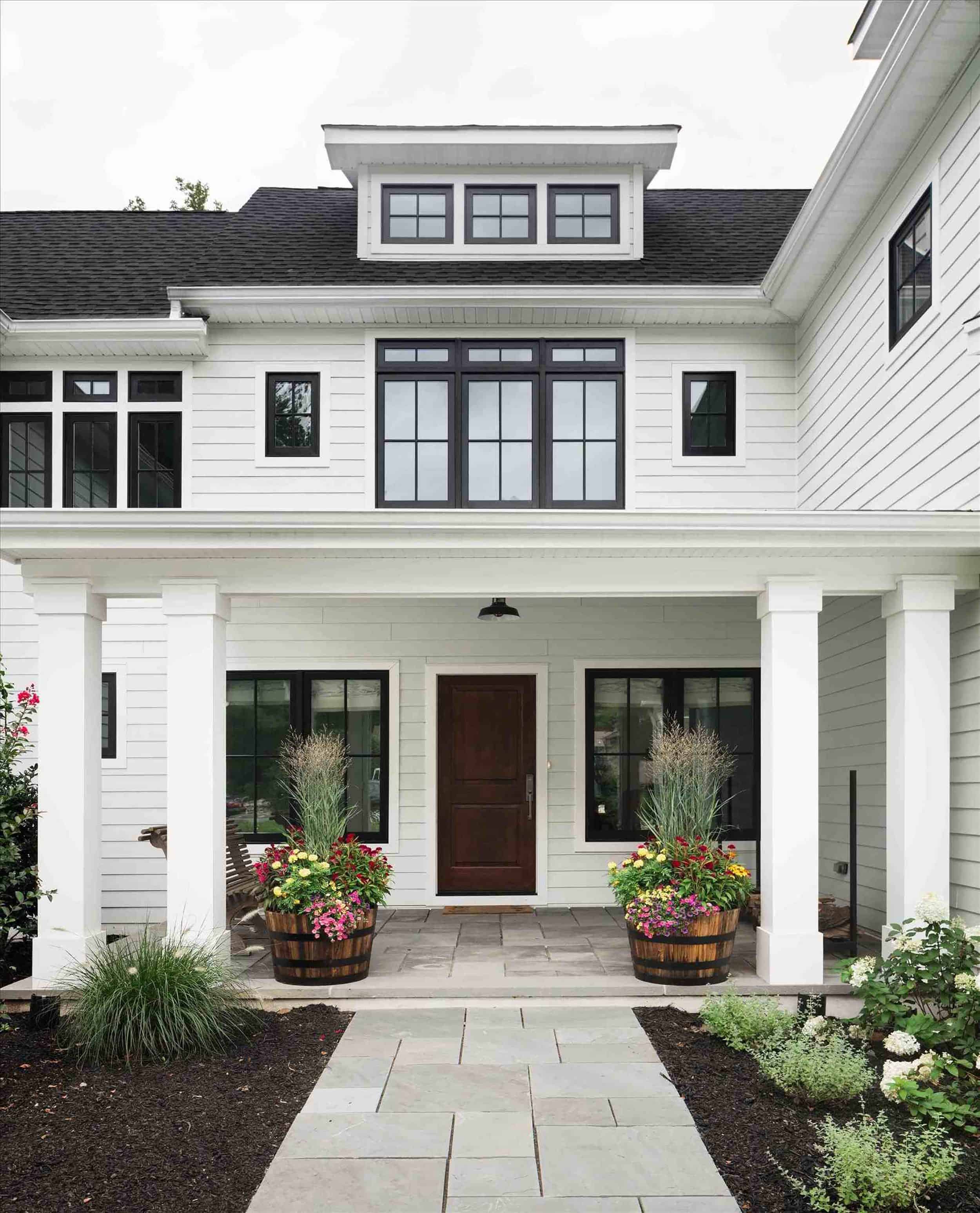 Traditional White Home With Dark Wood Door
