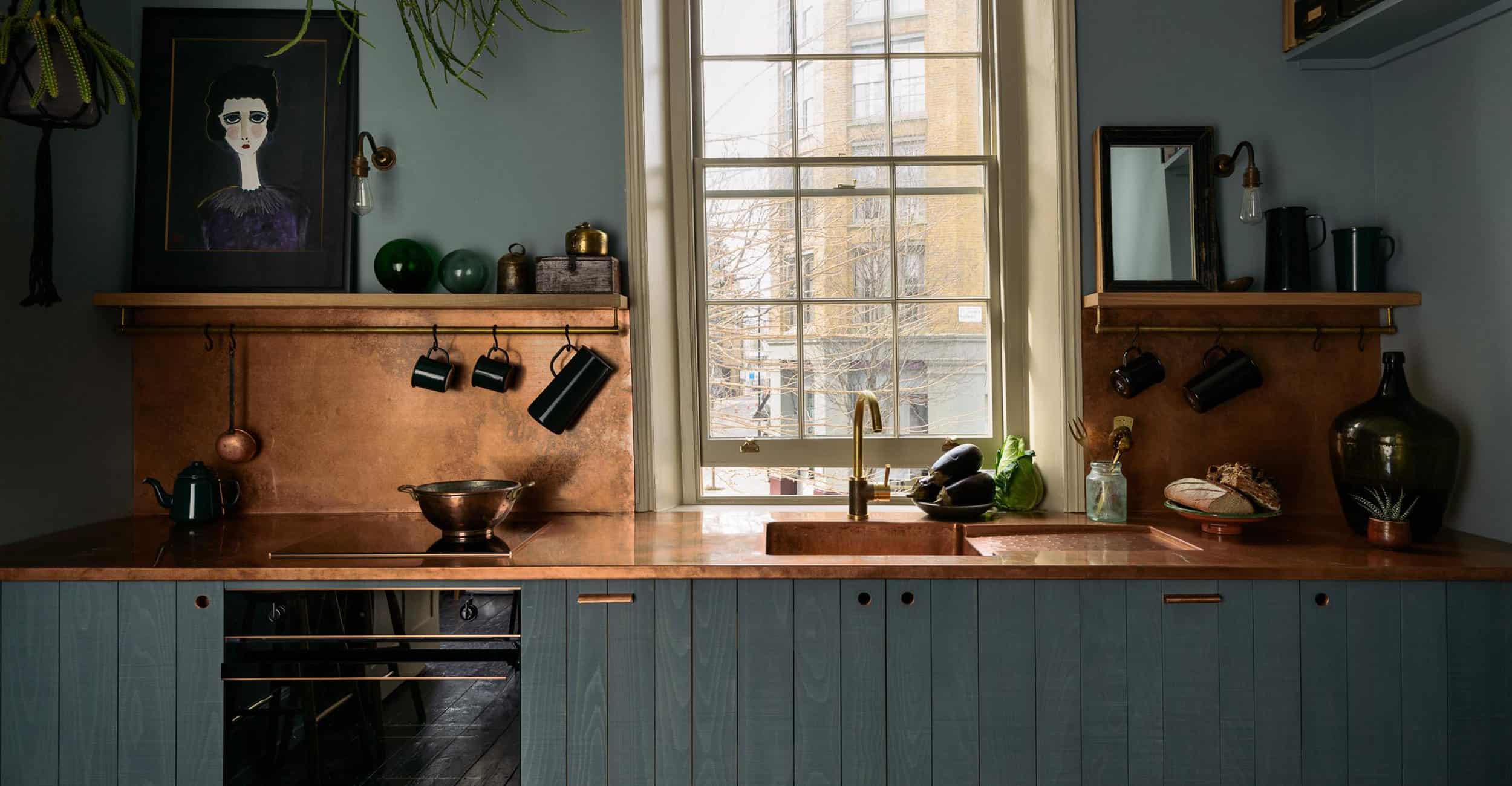 Dark Painted Wood Kitchen Copper Backsplash