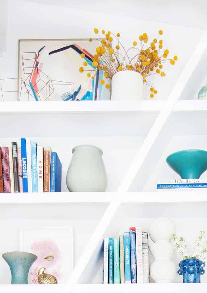 Emily Henderson Bookcase midcentury modern clean white accessories