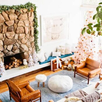 neutral holiday decorating living room fireplace garland white gold blue copper