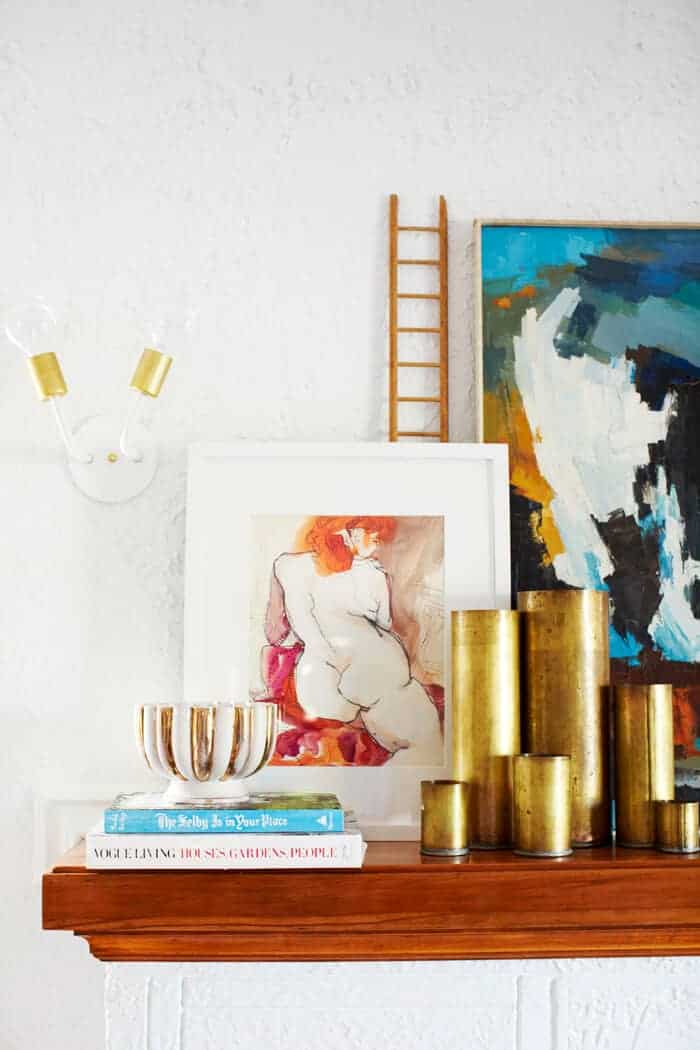 white and brass sconce