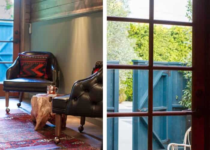 mancave_rustic_bar_black_leather_chairs_blue_fence_candelabra