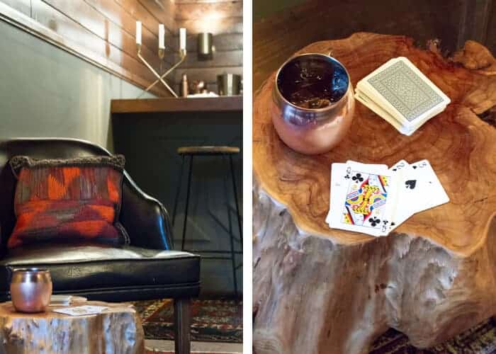 mancave_rustic_cards_moscow_mule_trunk_table_gold_candelabra